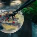 clear wine glass with liquid in focus photography